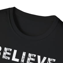 Load image into Gallery viewer, This view shows the collor of a soft black cotton t-shirt with the popular word BELIEVE in white, faded lettering. It&#39;s either the UFO and conspiracy theory or even trust and faith! This popular message relates to nearly every situation.

